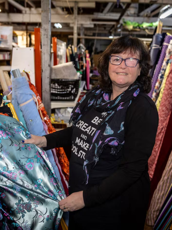 Yvonne_Hook_The_Costume_Queen_with_Fabric Yvonne the Costume Queen with rolls of fabric